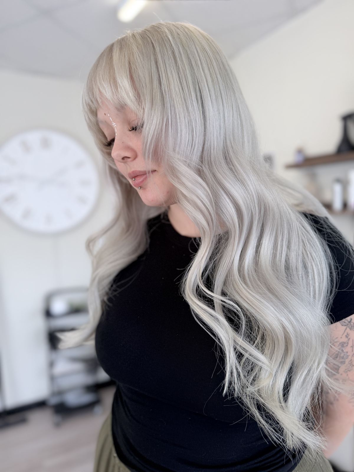 Long icy blonde waves with soft fringe